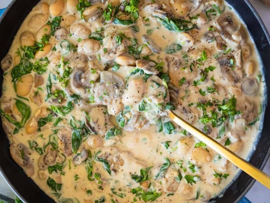 Healthy Marsala butter beans in creamy sauce garnished with parsley and served warm.