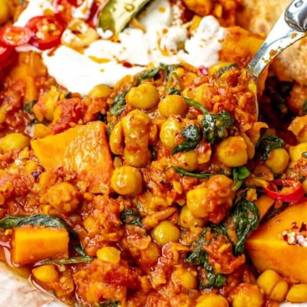 Hearty turmeric chickpea stew served with yogurt and lemon.