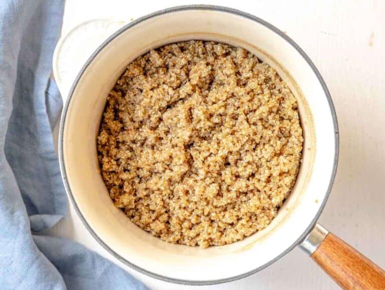 Step 1 Cooked and fluffed-up quinoa in a cast iron pot.