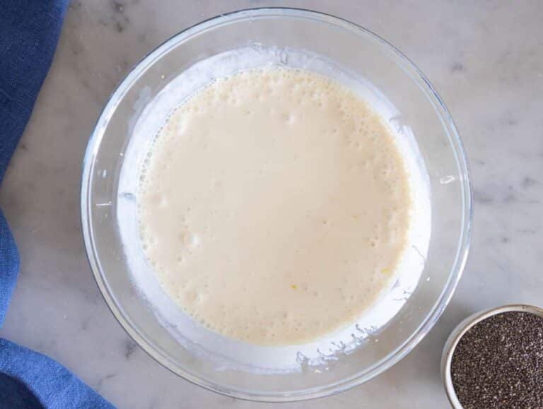 Step 1 Mixing Greek yogurt milk honey and vanilla in a bowl to make chia pudding base.