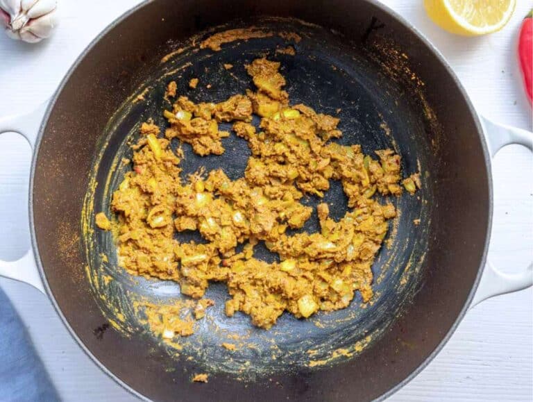 Step 1 Onions garlic ginger and spices cooking in a skillet for chickpea masala base.