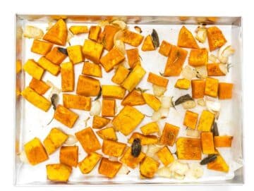 Step 1 Roasted pumpkin onion and garlic golden and caramelized on a baking sheet.
