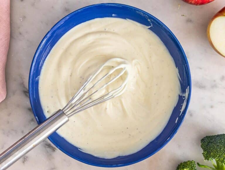 Step 1 Whisking Greek yogurt dressing with honey mustard and vinegar in a small bowl.