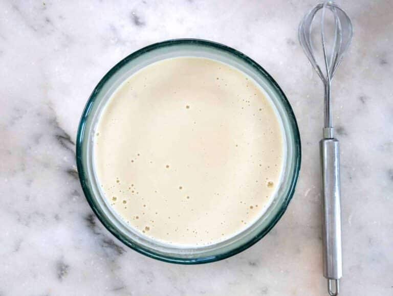 Step 1 Whisking tahini lemon and water to make creamy dressing for chickpea salad.