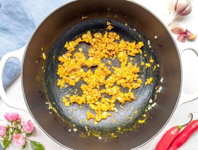 Step 1 – Cooking onion garlic ginger and spices in olive oil for turmeric chickpea stew base.