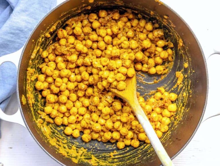 Step 2 Chickpeas added to skillet with spices salt and pepper for chickpea masala.