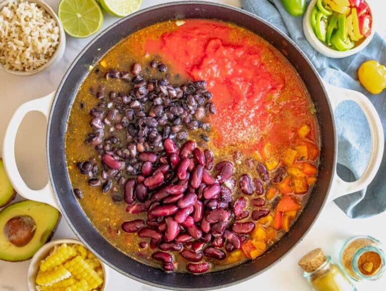 Step 2 Chili with beans simmering in a pot with tomatoes beans and broth.
