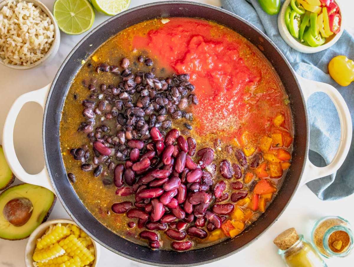 Step 2 Chili with beans simmering in a pot with tomatoes beans and broth.