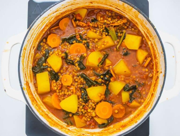 Step 2 Lentils, tomatoes, spinach and potatoes simmering gently in broth.