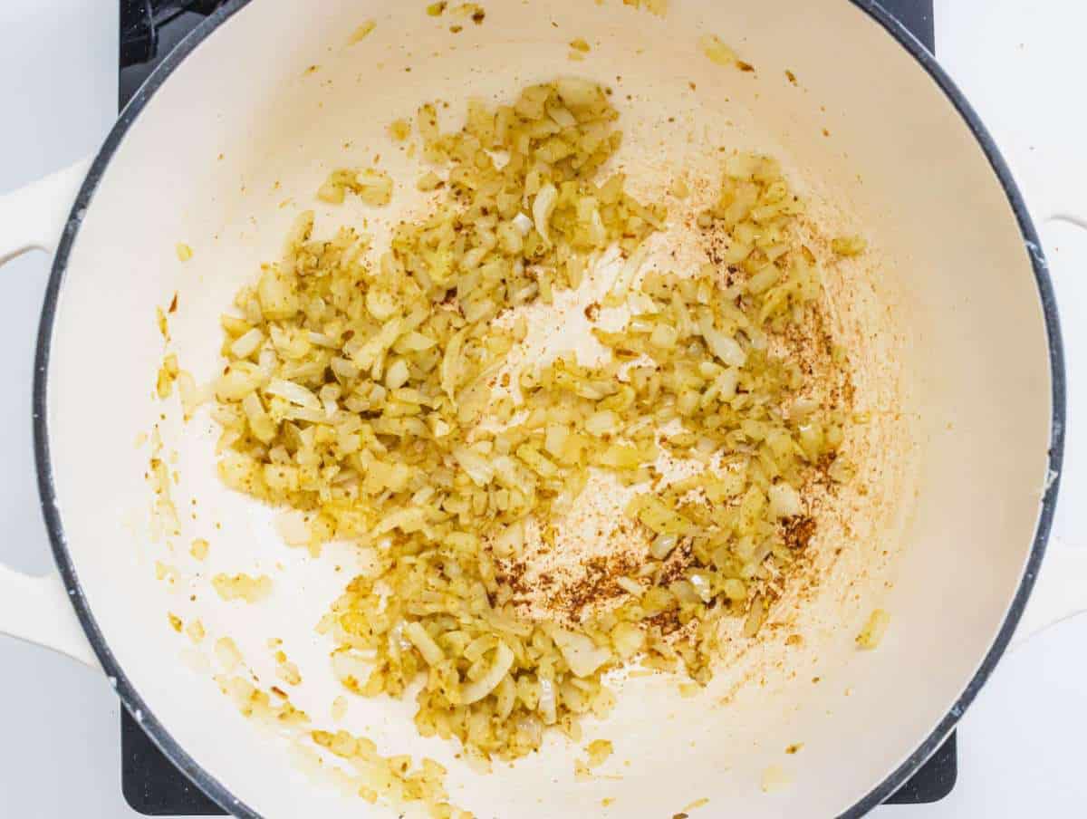 Step 3 Onion garlic and ginger sautéing in a pot with olive oil and red pepper flakes.