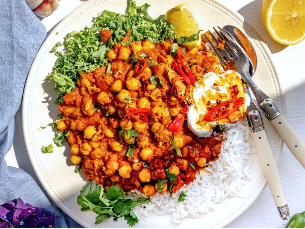 Step 4 Chickpea masala served with rice lemon cilantro and yogurt ready to enjoy.