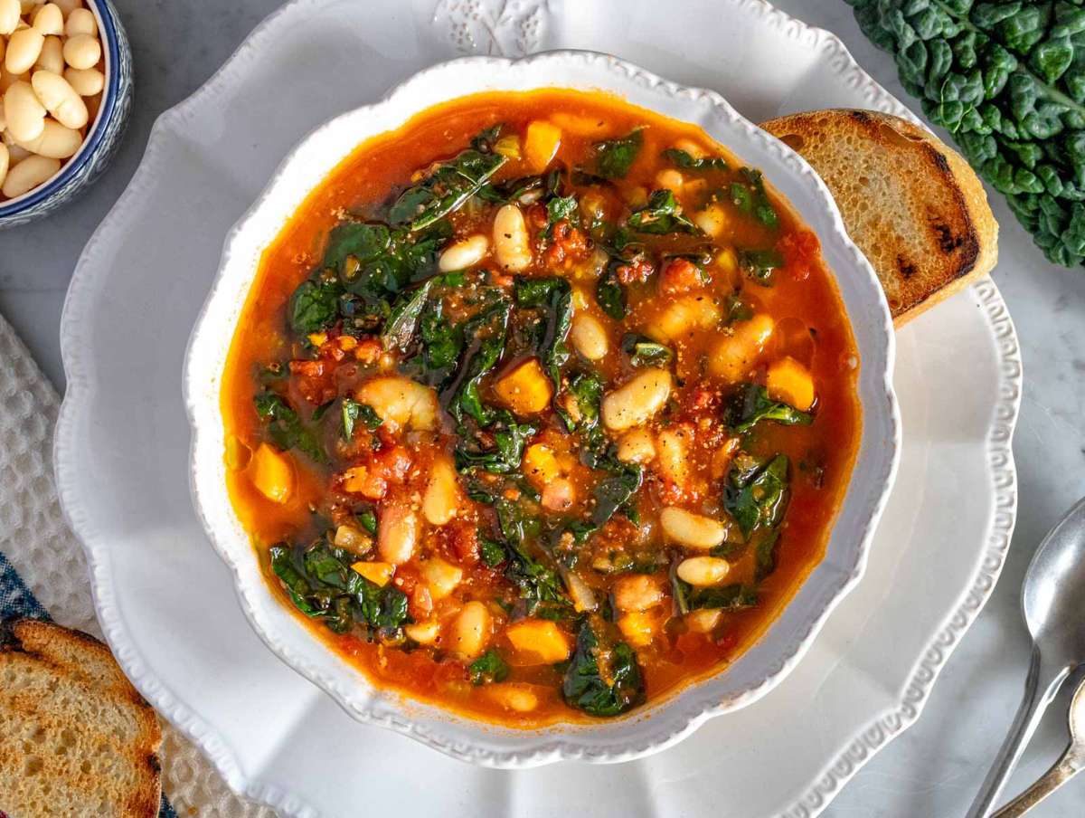 Step 4 Serving Mediterranean kale soup with a olive oil and slice of crusty bread.