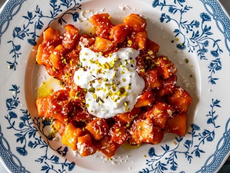 Sweet potato gnocchi with marinara sauce, burrata, and parmesan.