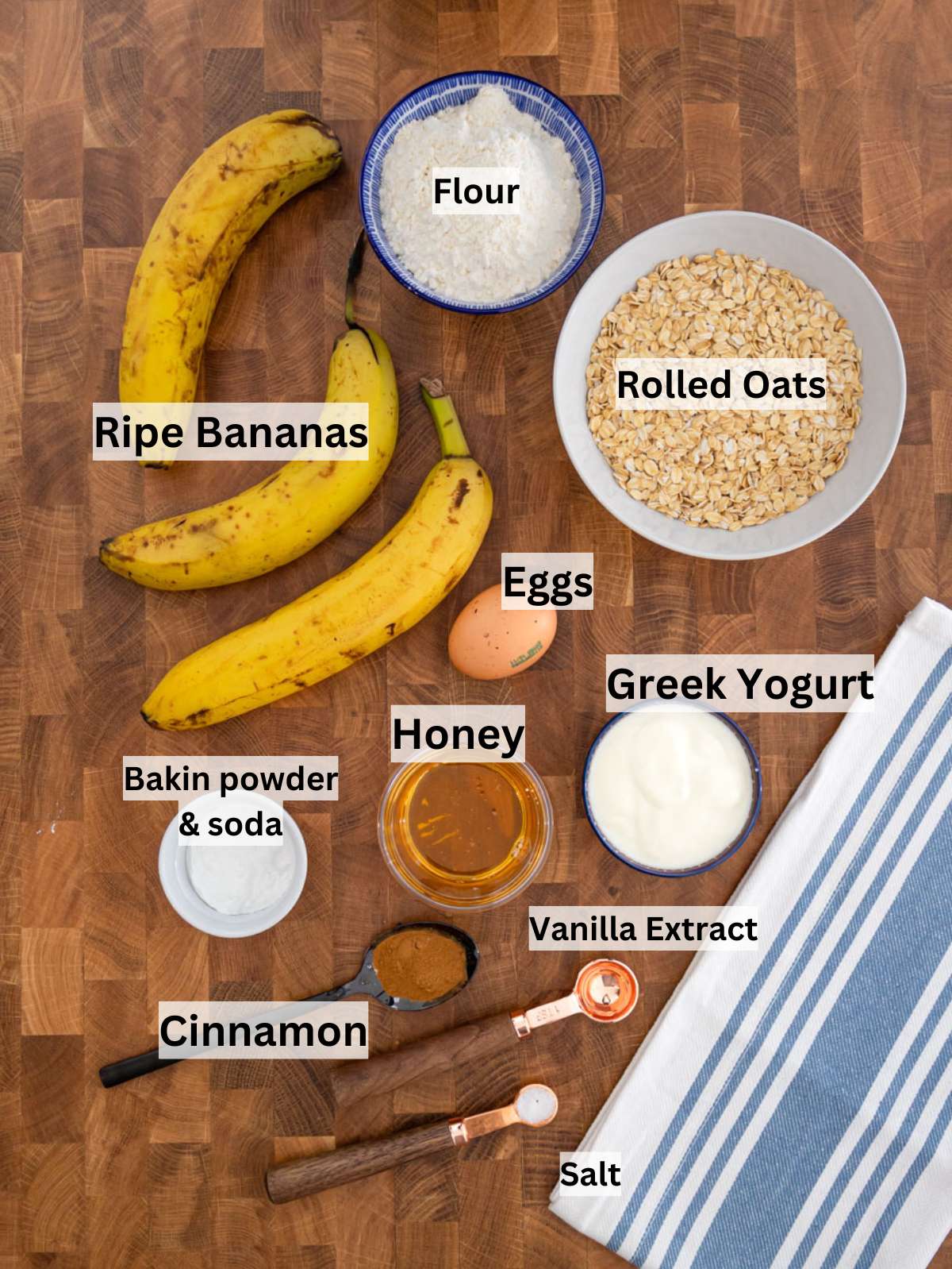 Baking ingredients for banana oatmeal muffins including bananas oats yogurt honey and flour.