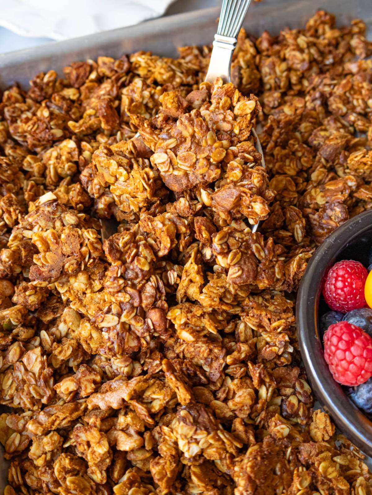 Crispy oil free granola clusters showing texture and nuts for a healthy breakfast.