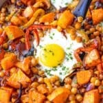 Feature image sheet pan eggs and veggies roasted sweet potatoes chickpeas and golden eggs.