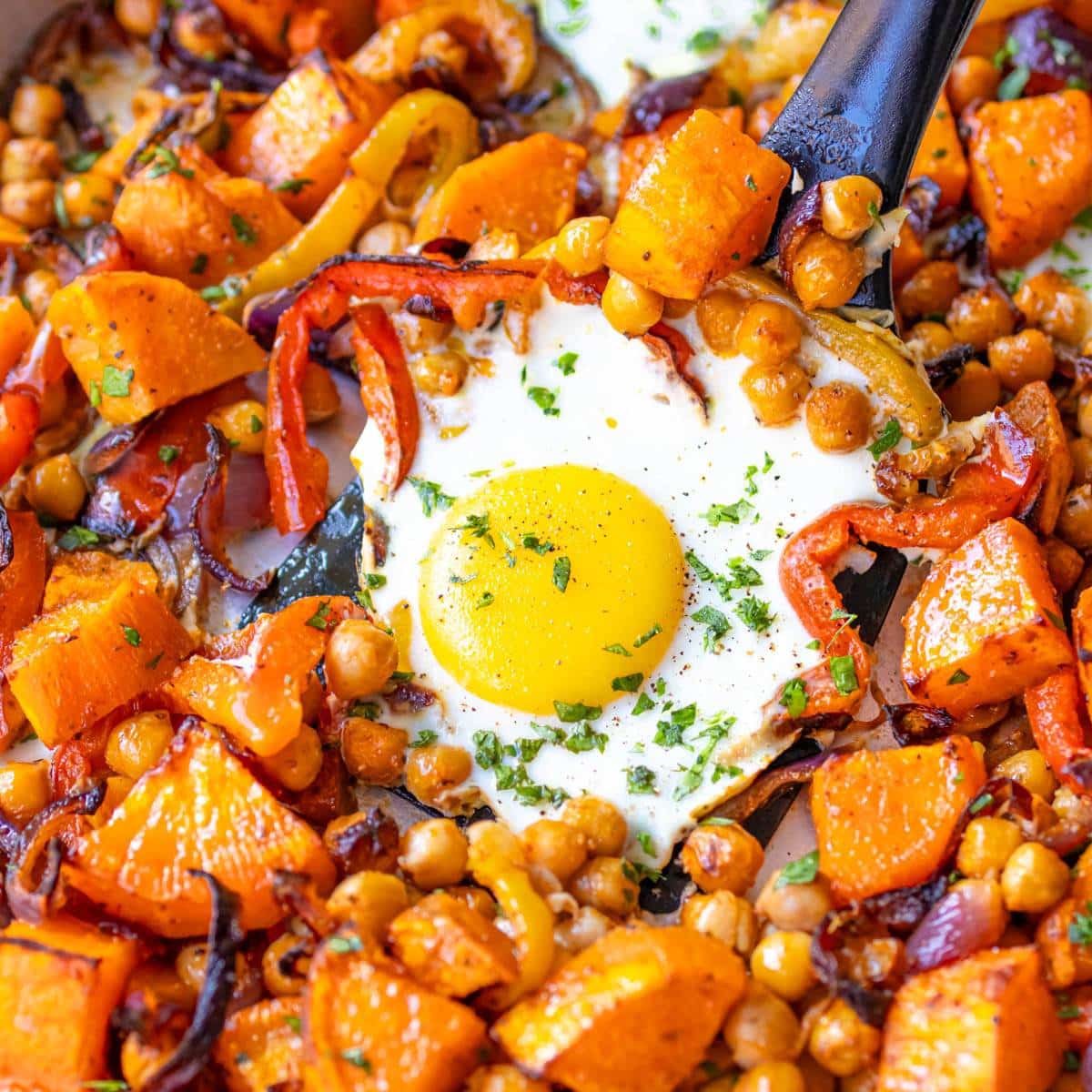 Feature image sheet pan eggs and veggies roasted sweet potatoes chickpeas and golden eggs.