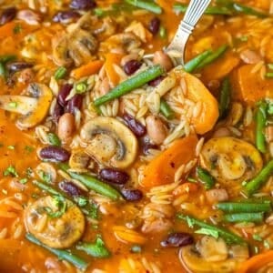 Feature image vibrant three bean orzo soup healthy Mediterranean one pot dinner.