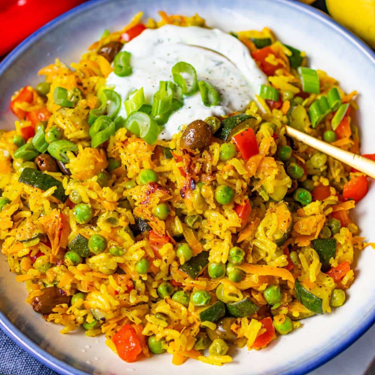 Golden Mediterranean Stir Fry with colorful vegetables rice cooked in turmeric sauce.