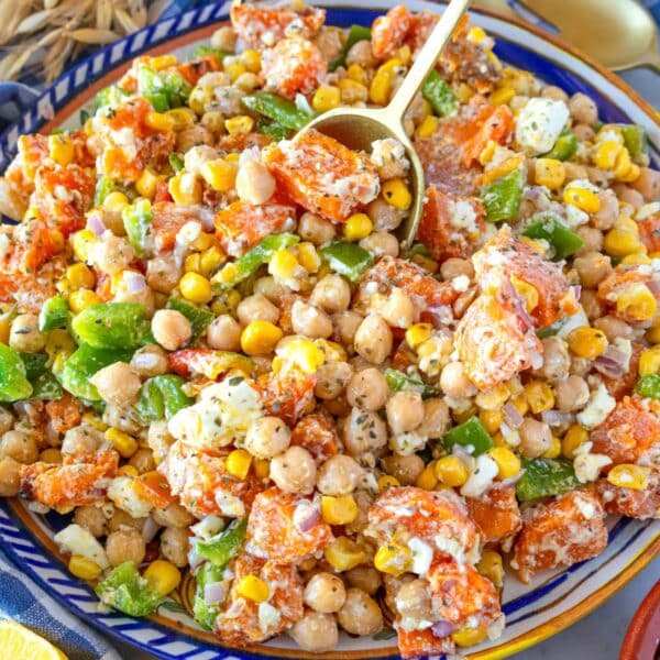 Healthy chickpea sweet potato salad with crunchy vegetables and creamy feta.