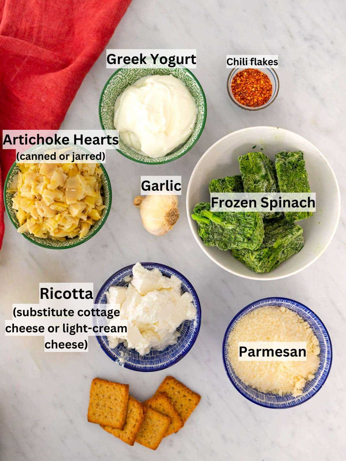 Ingredients arranged neatly for healthy spinach artichoke dip preparation.
