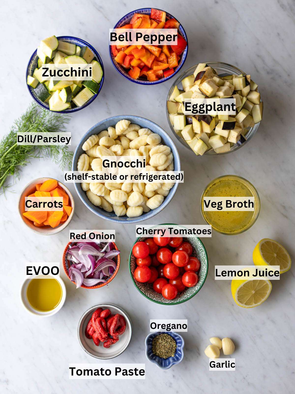 Ingredients for Greek sheet pan gnocchi arranged neatly on a kitchen counter.