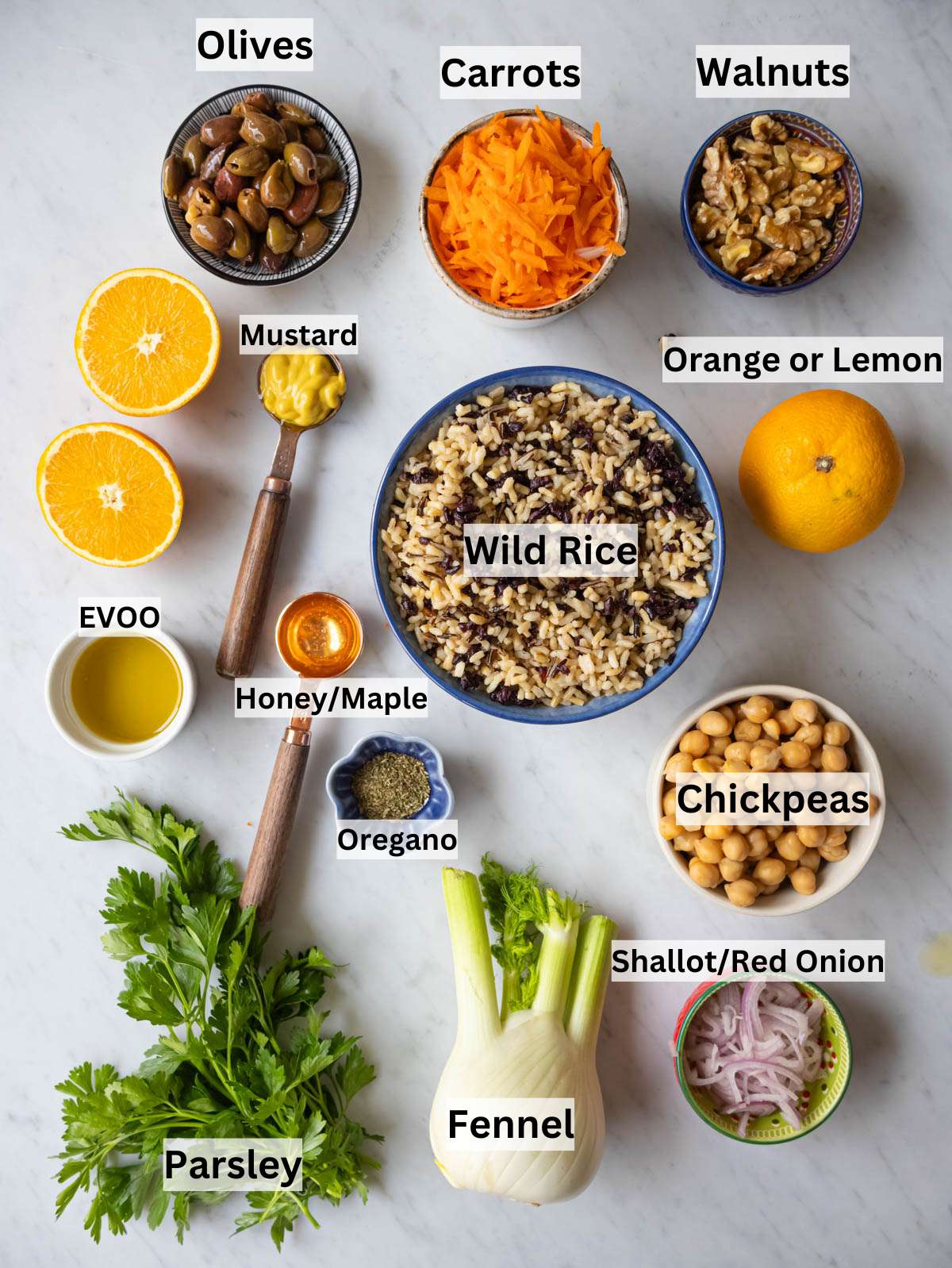 Ingredients picture fresh vegetables chickpeas wild rice and citrus arranged for Mediterranean rice salad.