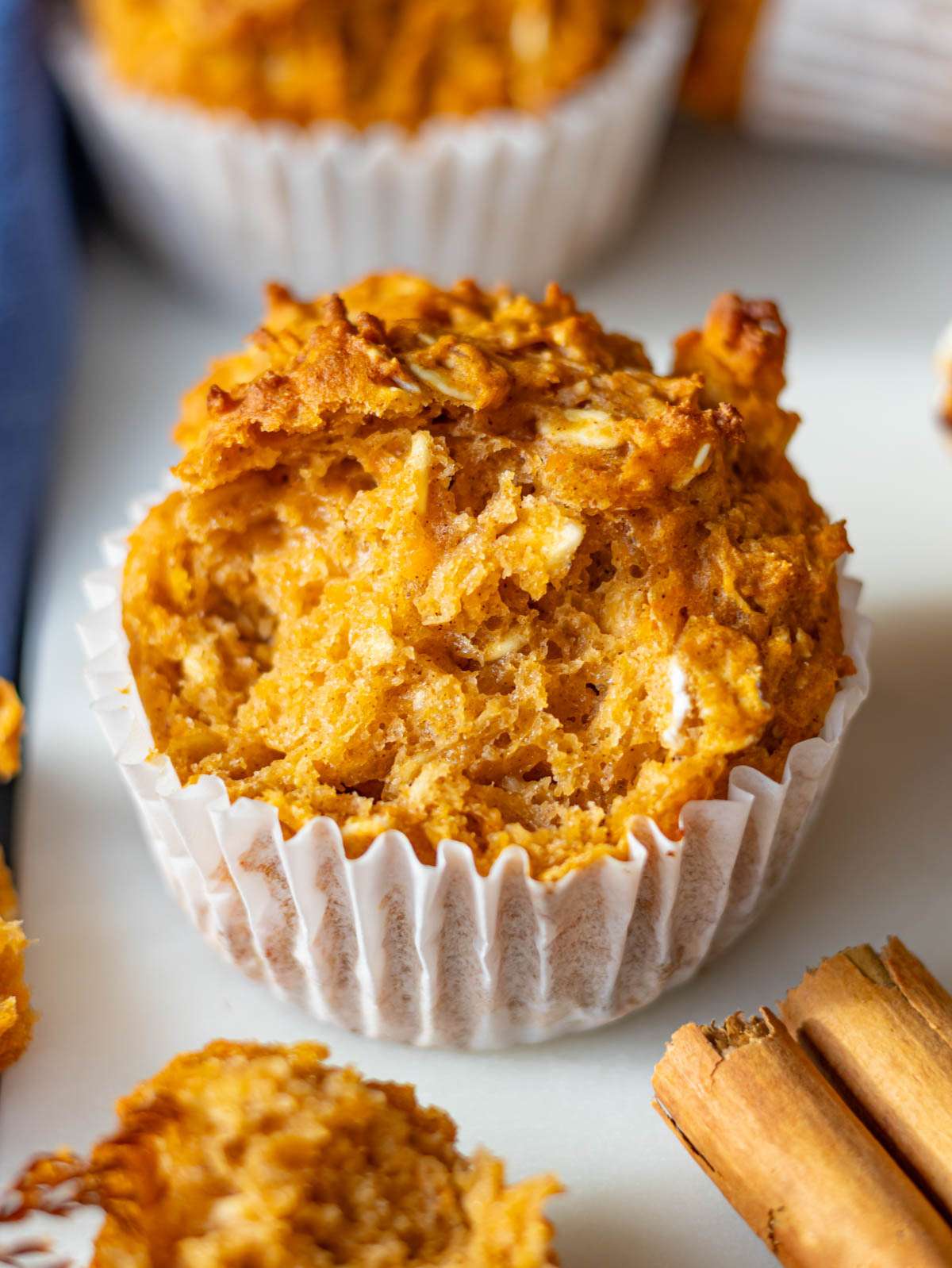 Soft sweet potato oatmeal muffins showing moist crumb and warm cinnamon color.