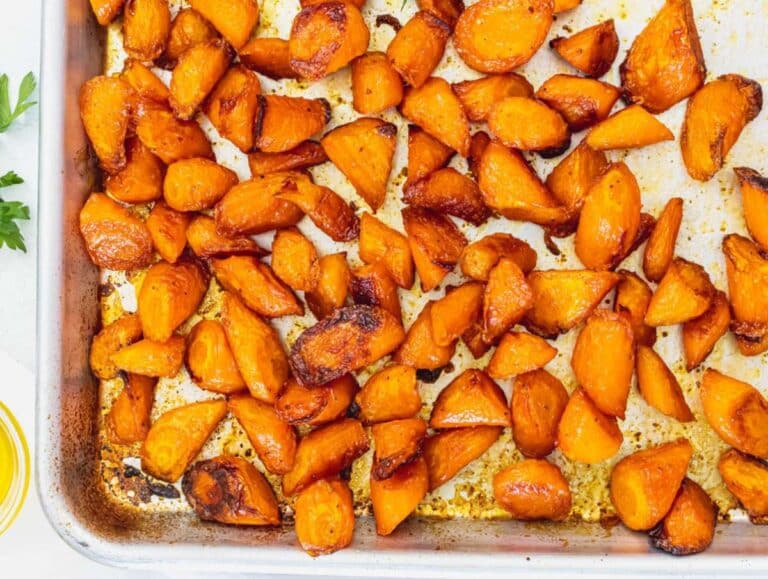 Step 1 Chopped carrots tossed in olive oil and paprika and roasted until tender.