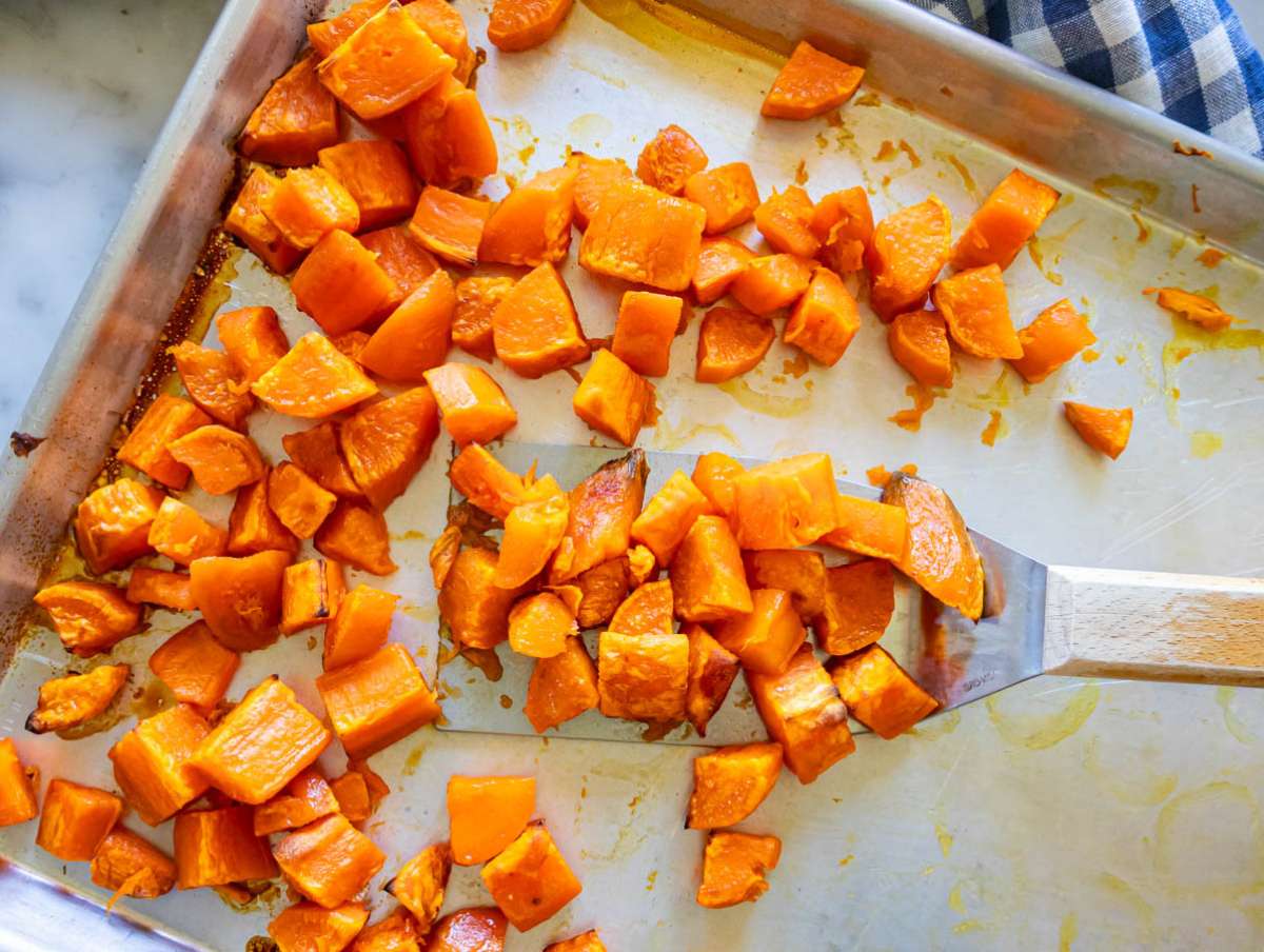 Step 1 Fork tender roasted sweet potatoes after 25 minutes in the oven.