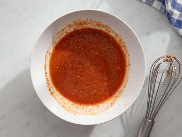Step 1 Making sauce broth lemon tomato paste and garlic whisked in small bowl.