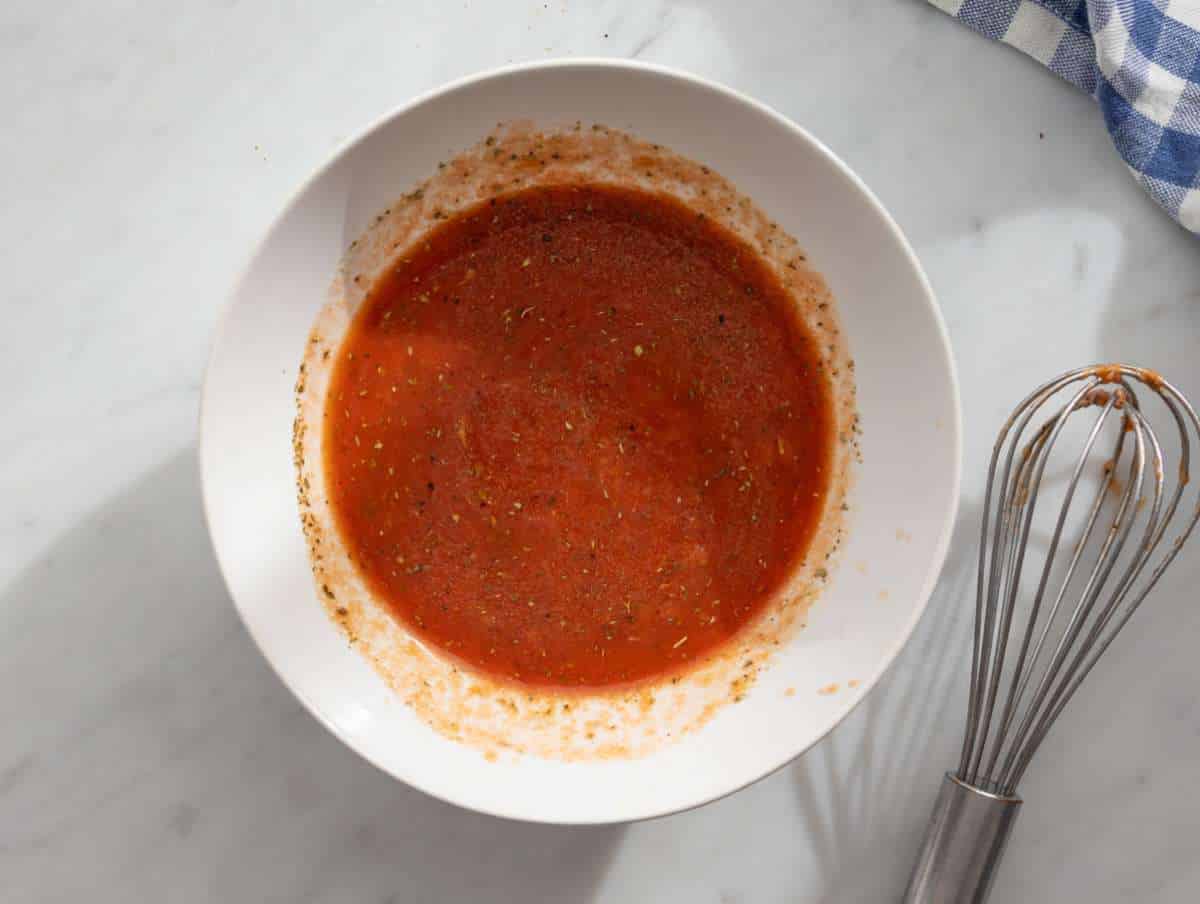 Step 1 Making sauce broth lemon tomato paste and garlic whisked in small bowl.