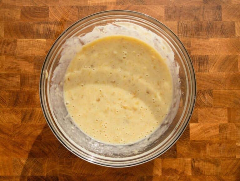 Step 1 Mashed ripe banana mixed with egg Greek yogurt honey and vanilla extract in a bowl.