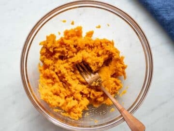 Step 1 Mashed sweet potatoes in a bowl ready for baking sweet potato oat muffins.