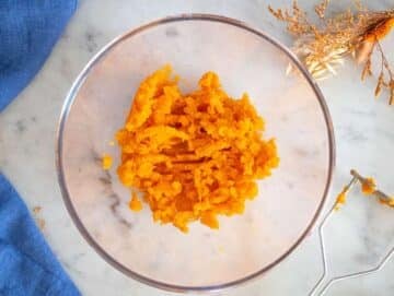 Step-1-Mashing-cooked-sweet-potatoes-in-a-bowl-until-smooth-for-moist-bread-texture