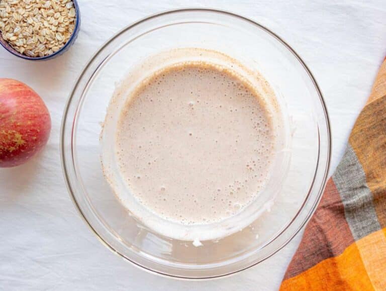 Step 1 Mixing milk, Greek yogurt, applesauce, honey, and cinnamon in a bowl for creamy oats.