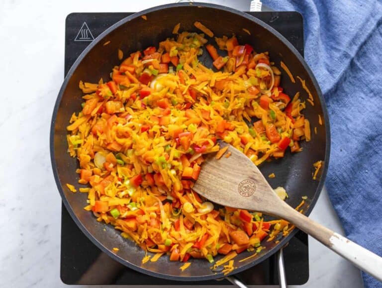 Step 2 Sautéed carrots peppers green onions in skillet for Mediterranean stir fry.