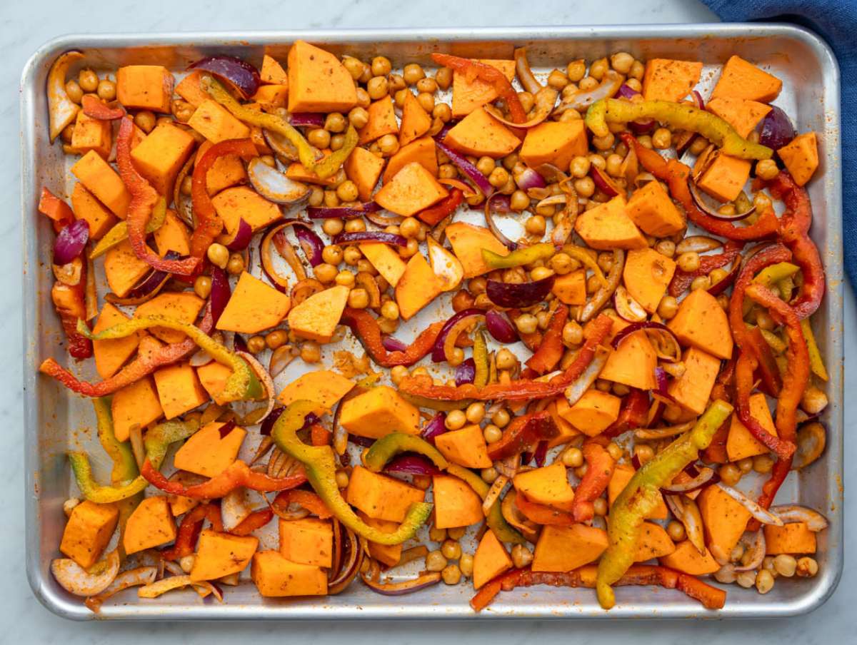 Step 2 Step season veggies and chickpeas tossed with olive oil paprika cumin and garlic.
