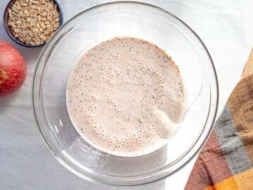 Step 2 Stirring rolled oats and chia seeds into the creamy apple mixture.