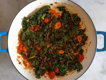 Step 2 Stirring tomato paste rosemary and garlic in skillet for Mediterranean orzo recipe.