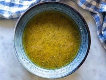 Step 2 Whisking honey mustard olive oil lemon juice and oregano in a bowl for the dressing.