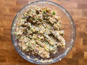 Step 2 image Mixing lentil potato patty ingredients with herbs and flour in a large bowl.
