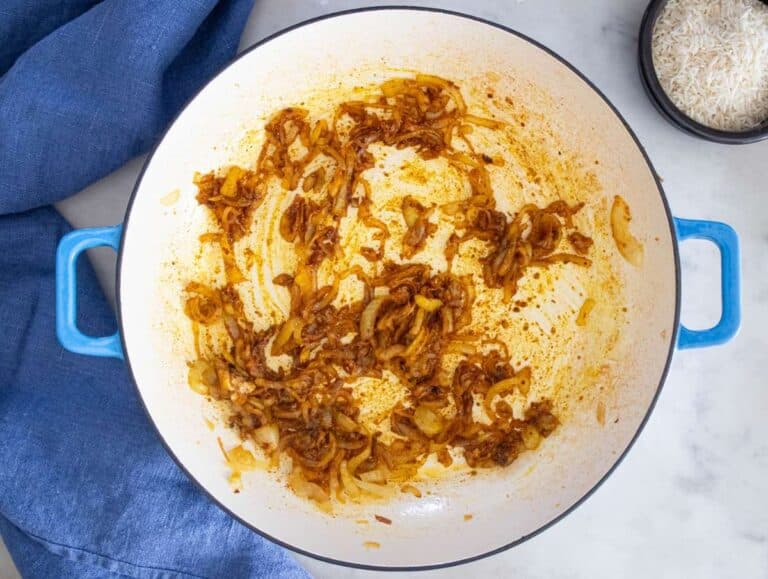 Step 2 – adding spices and garlic to caramelized onions for Mediterranean flavor.