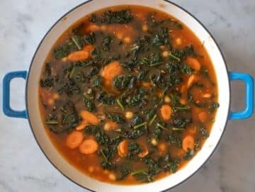 Step 3 Adding chickpeas broth and seasonings to pan for quick chickpea orzo meal.
