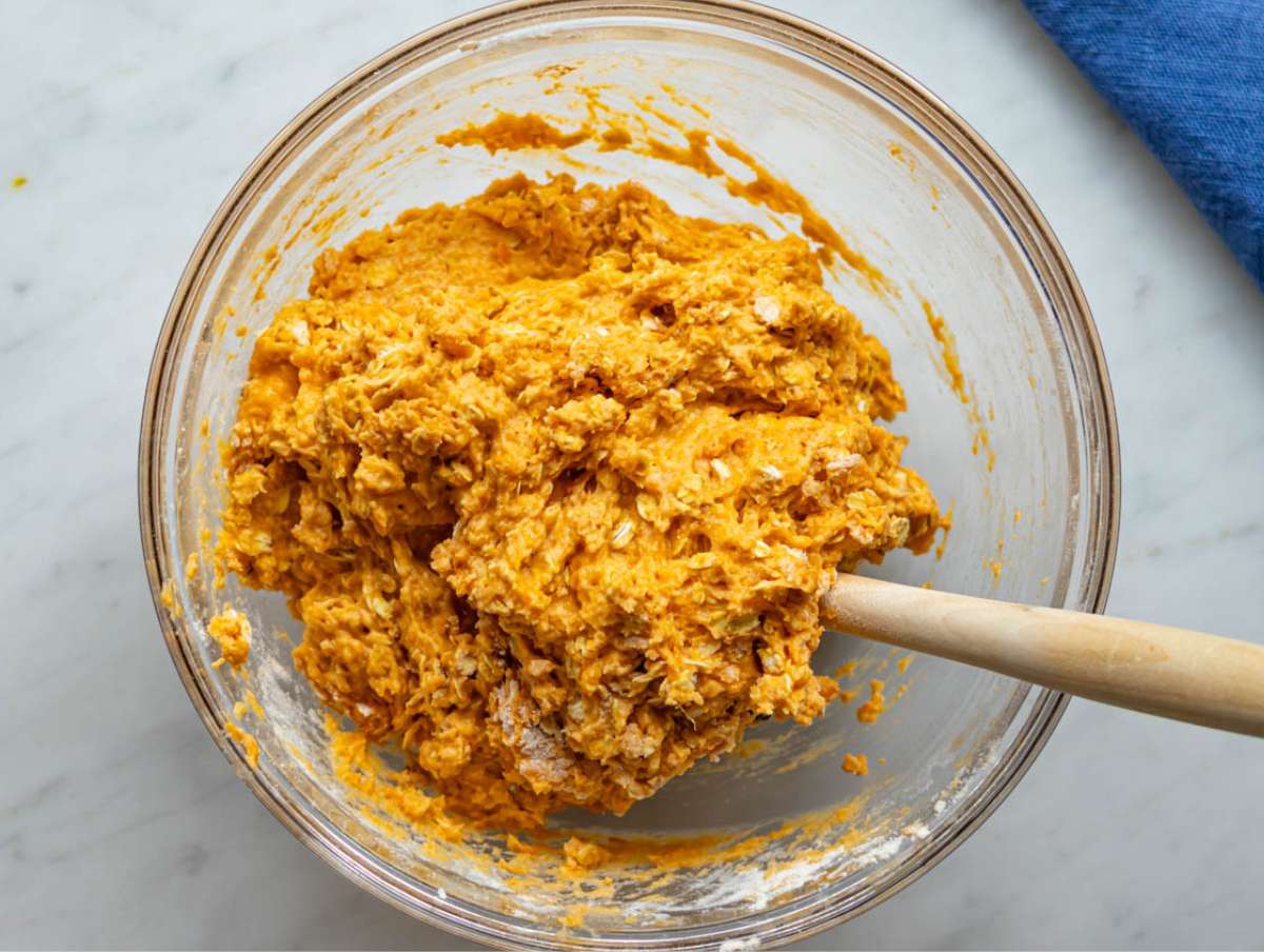 Step 3 Dry ingredients added to bowl creating thick muffin batter with oats and sweet potato.