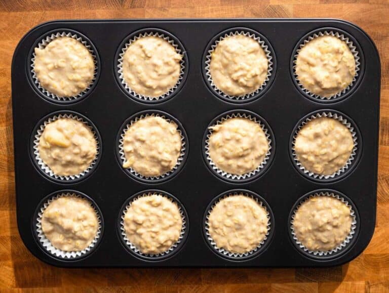Step 3 Filling muffin pan with banana oatmeal batter before baking.