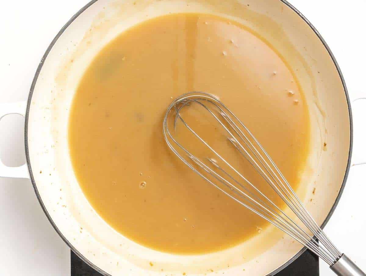 Step 3 Whisking flour butter broth and soy sauce to skillet for thickening.