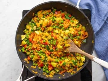 Step 3 Zucchini and peas added to skillet for easy veggie stir fry.