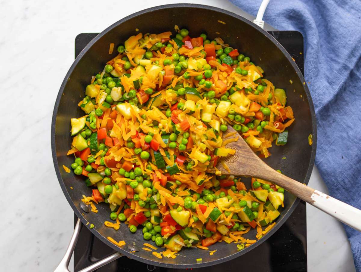 Step 3 Zucchini and peas added to skillet for easy veggie stir fry.