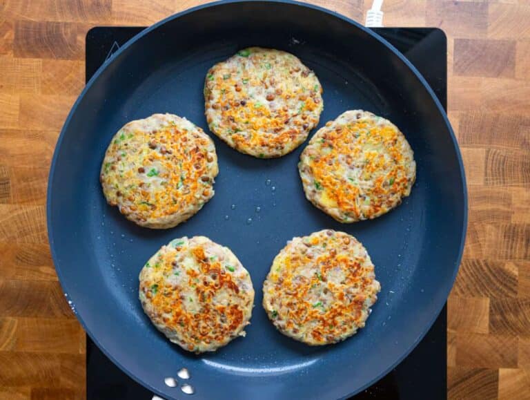 Step 3 image Lentil potato patties sizzling in a nonstick pan until golden and crisp.